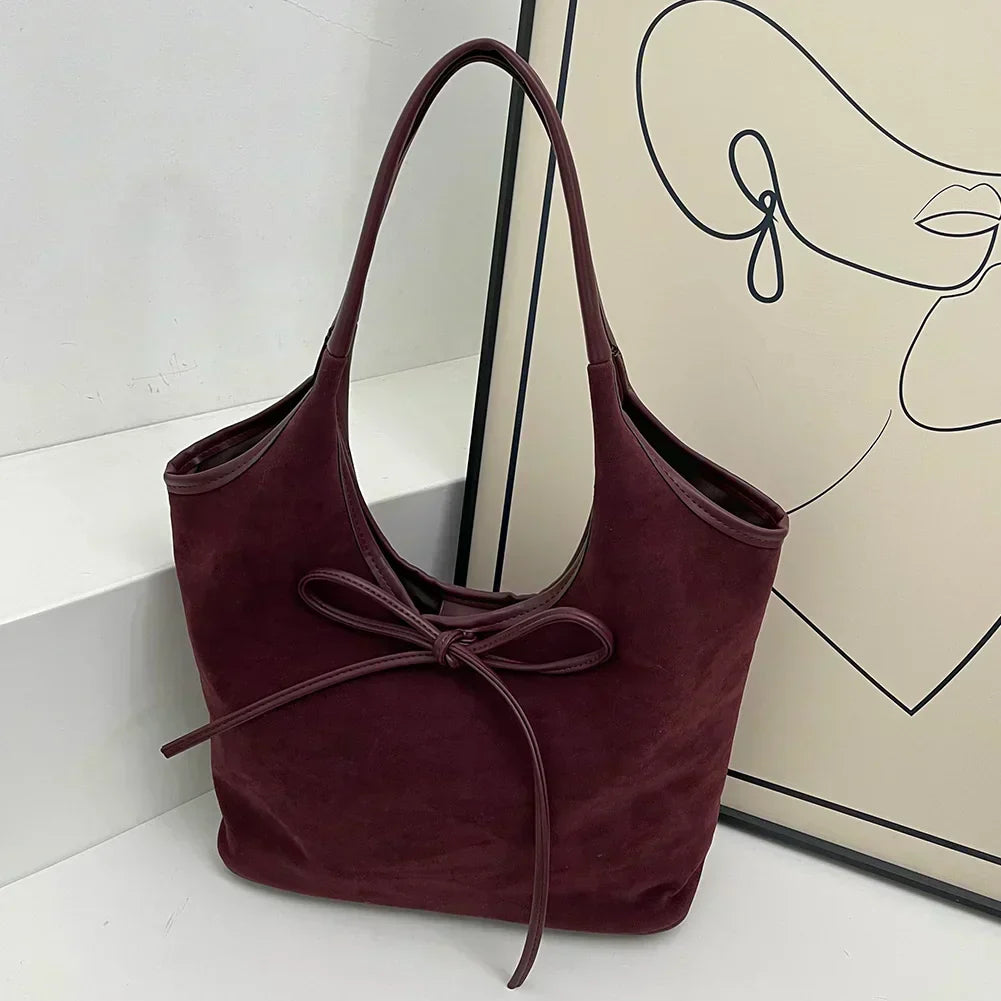 Carla™ | Borsa con fiocco