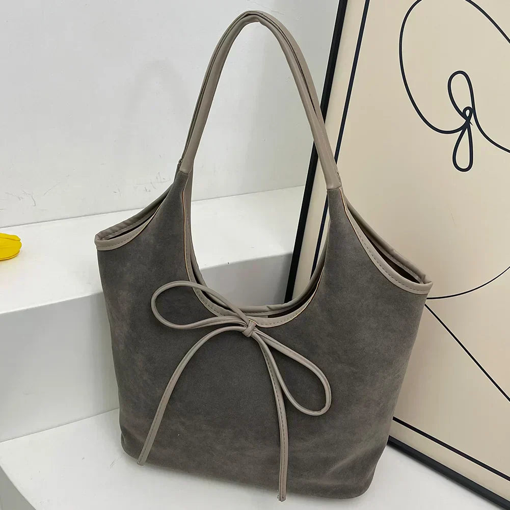 Carla™ | Borsa con fiocco