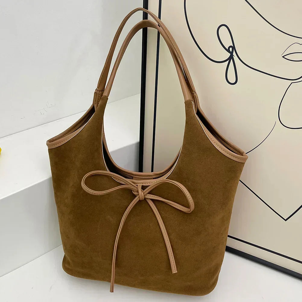 Carla™ | Borsa con fiocco