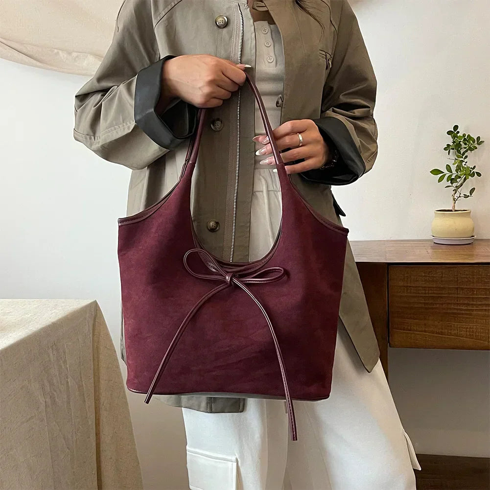 Carla™ | Borsa con fiocco